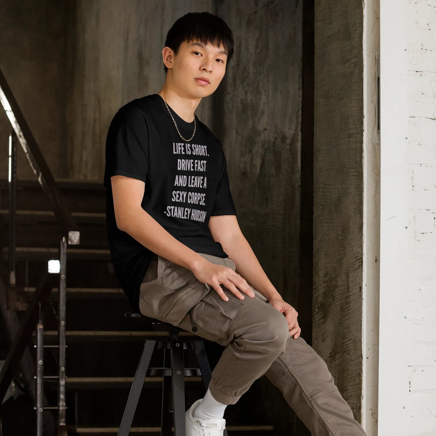 Life is Short Tee in Black on man on stool